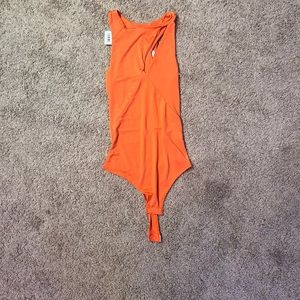 Body suit with slit on the front